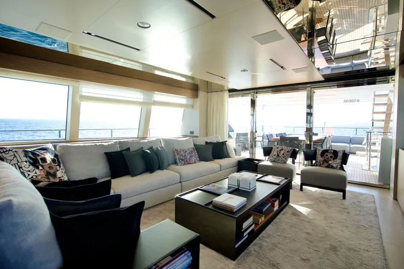 M Forever Yacht Photos Pics Luxurious interior of 2021 Custom Line Navetta 33 yacht with modern furnishings and ocean view.