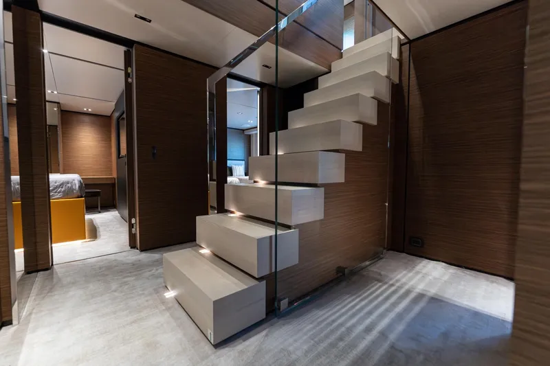 M Forever Yacht Photos Pics Luxurious interior of 2021 Custom Line Navetta 33 yacht with modern staircase design.