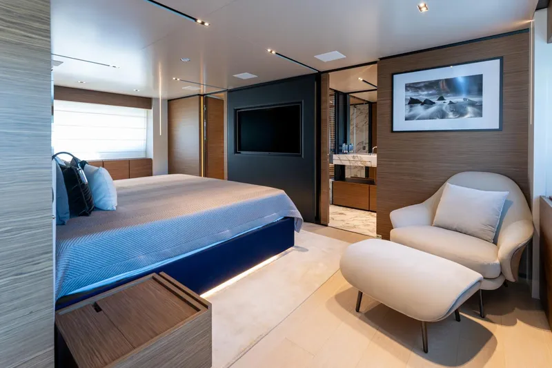 M Forever Yacht Photos Pics Luxurious bedroom interior on 2021 Custom Line Navetta 33 yacht, featuring modern design and elegant furnishings.