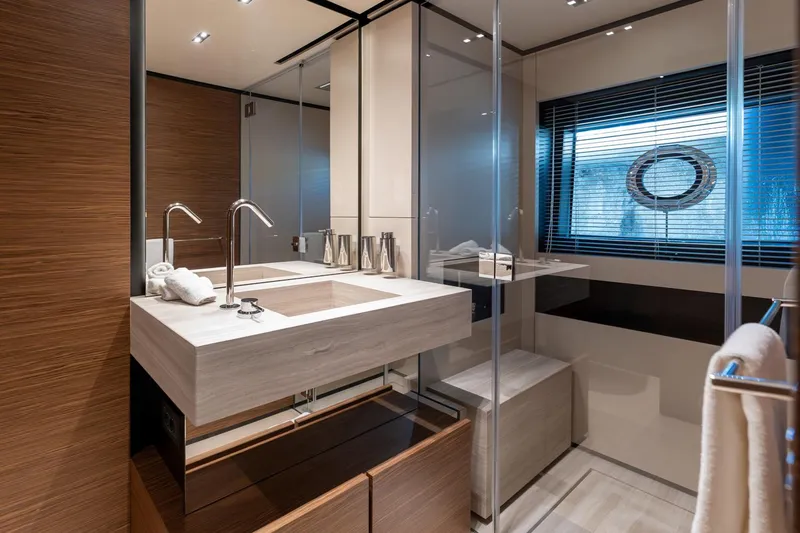 M Forever Yacht Photos Pics Luxurious bathroom interior on 2021 Custom Line Navetta 33 yacht, featuring modern fixtures and elegant design.