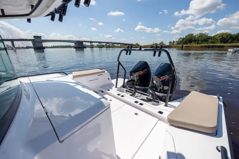  Yacht Photos Pics 2024 Axopar 37 XC boat with twin Mercury engines on a calm river.