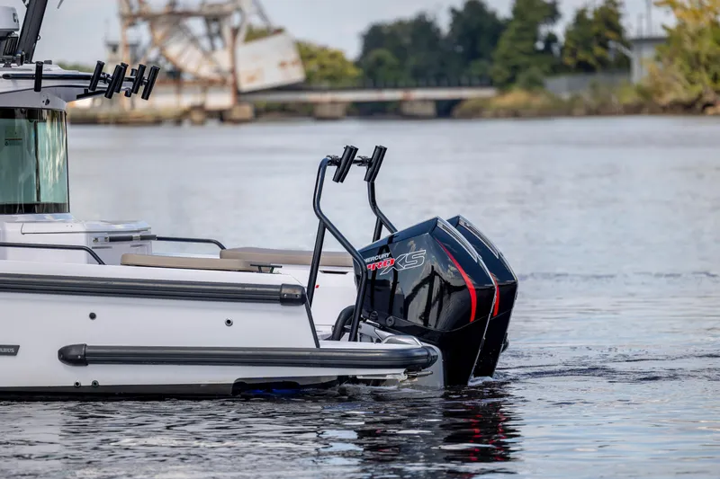  Yacht Photos Pics 2024 Axopar 37 XC boat with Mercury Pro XS engines on a calm river.