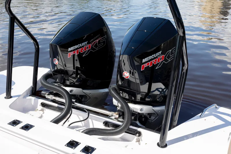  Yacht Photos Pics Twin Mercury Pro XS engines on 2024 Axopar 37 XC boat, docked on water.