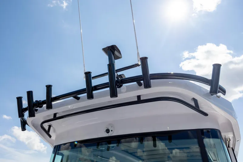  Yacht Photos Pics Rooftop view of 2024 Axopar 37 XC boat under a sunny sky.