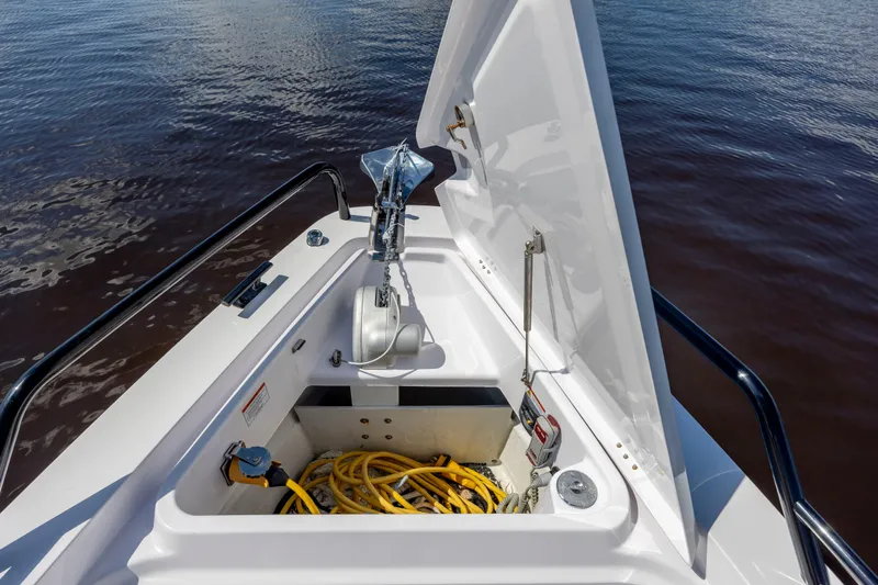  Yacht Photos Pics 2024 Axopar 37 XC boat anchor compartment with storage and equipment.