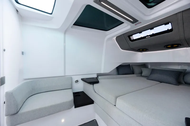  Yacht Photos Pics Luxurious interior of 2024 Axopar 37 XC boat with modern seating and skylights.