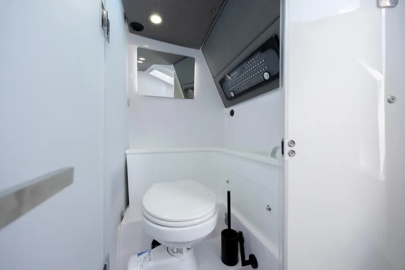  Yacht Photos Pics 2024 Axopar 37 XC boat interior bathroom with modern design and amenities.