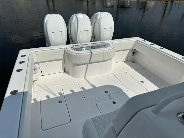  Yacht Photos Pics 2021 Invincible 390 Open CC boat with triple engines and spacious deck.