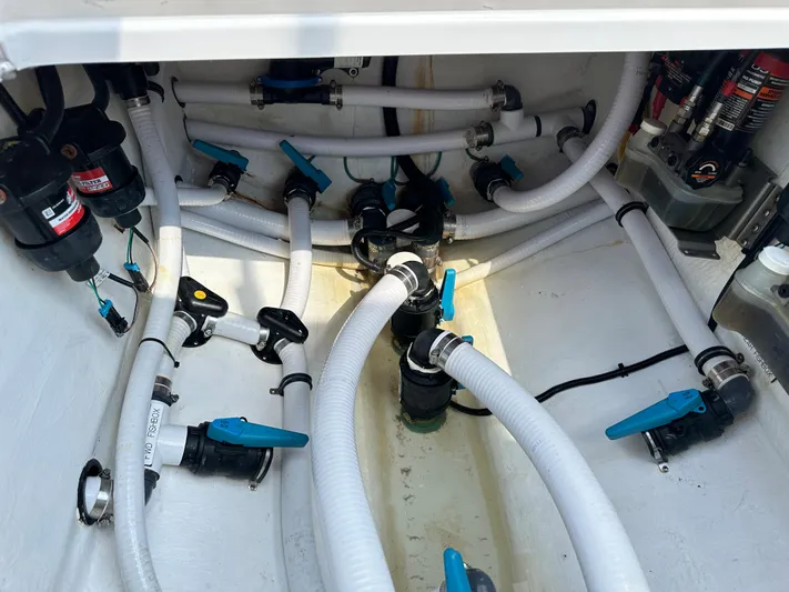  Yacht Photos Pics 2021 Invincible 390 Open CC boat plumbing system with hoses and valves.