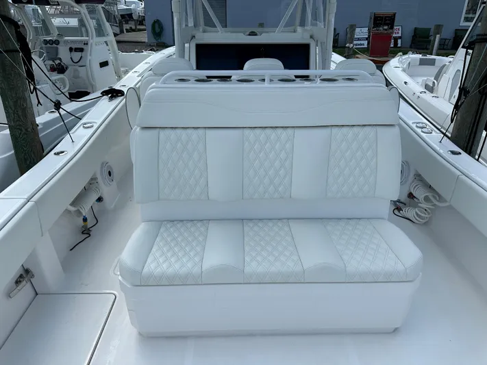  Yacht Photos Pics White seating on 2021 Invincible 390 Open CC boat, featuring diamond-pattern upholstery.