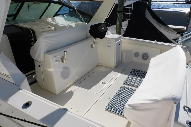 Squall Line Yacht Photos Pics 1995 Tiara Yachts 3500 Express boat interior with white seating and nautical features.