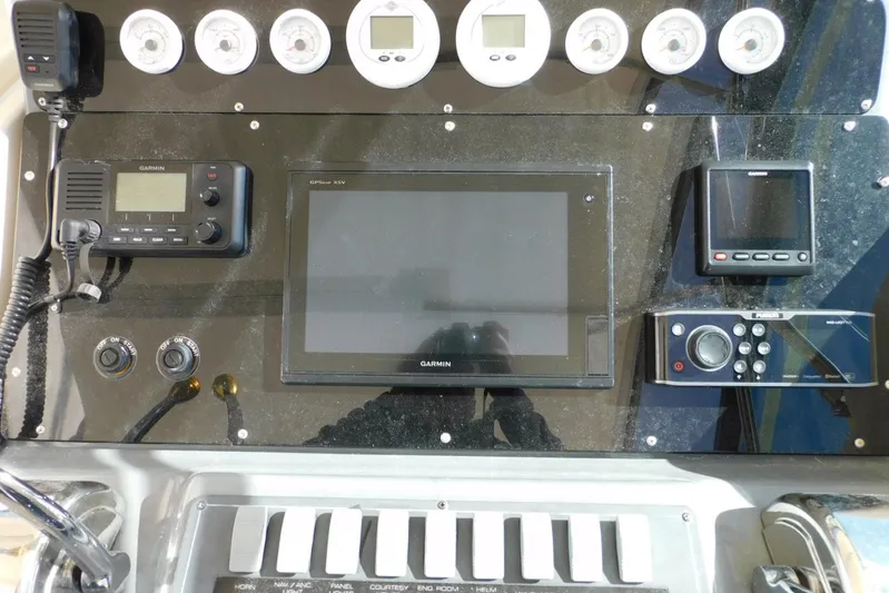 Squall Line Yacht Photos Pics 1995 Tiara Yachts 3500 Express dashboard with Garmin navigation and control systems.