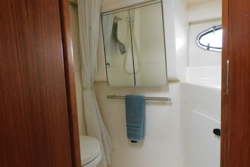 Squall Line Yacht Photos Pics Bathroom interior of 1995 Tiara Yachts 3500 Express with mirror and towel.