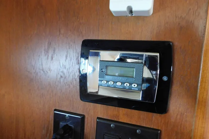 Squall Line Yacht Photos Pics Digital control panel on 1995 Tiara Yachts 3500 Express wooden interior.