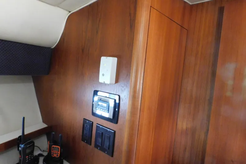 Squall Line Yacht Photos Pics Interior of 1995 Tiara Yachts 3500 Express with control panel and wooden finish.