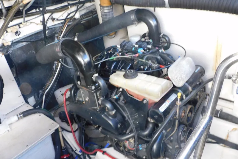 Squall Line Yacht Photos Pics Engine compartment of a 1995 Tiara Yachts 3500 Express, showcasing mechanical components and wiring.