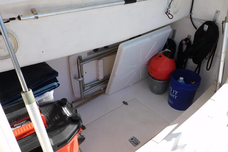 Squall Line Yacht Photos Pics Storage area on a 1995 Tiara Yachts 3500 Express, featuring equipment and supplies.