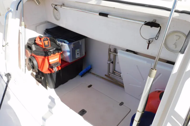 Squall Line Yacht Photos Pics 1995 Tiara Yachts 3500 Express storage area with equipment and supplies.