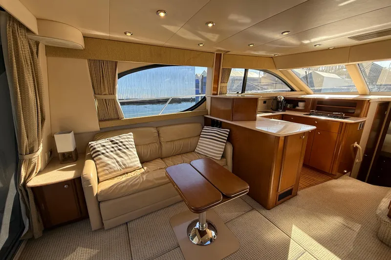 Gra-sea Yacht Photos Pics Luxurious interior of a 2005 Meridian 381 Sedan yacht with elegant furnishings.