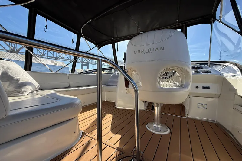 Gra-sea Yacht Photos Pics Interior of 2005 Meridian 381 Sedan yacht with sleek seating and modern helm.
