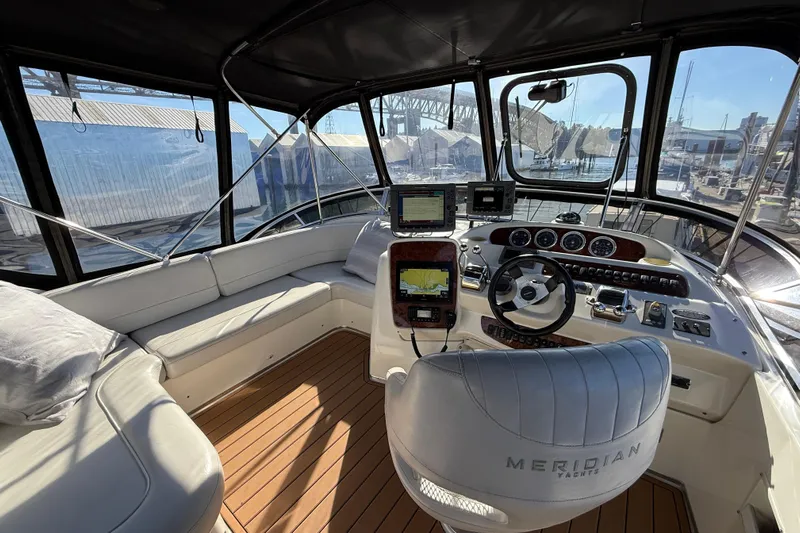 Gra-sea Yacht Photos Pics Interior of a 2005 Meridian 381 Sedan yacht with modern navigation equipment.