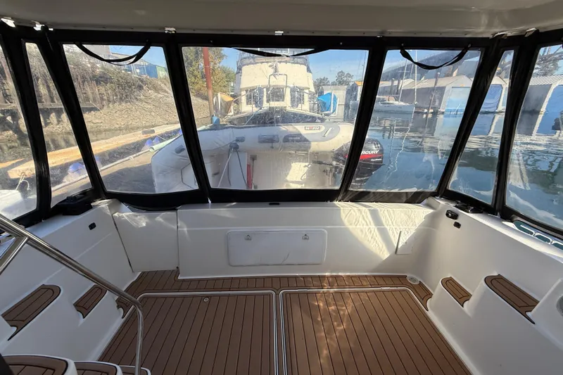 Gra-sea Yacht Photos Pics Interior view of 2005 Meridian 381 Sedan boat with enclosed cockpit and wooden flooring.