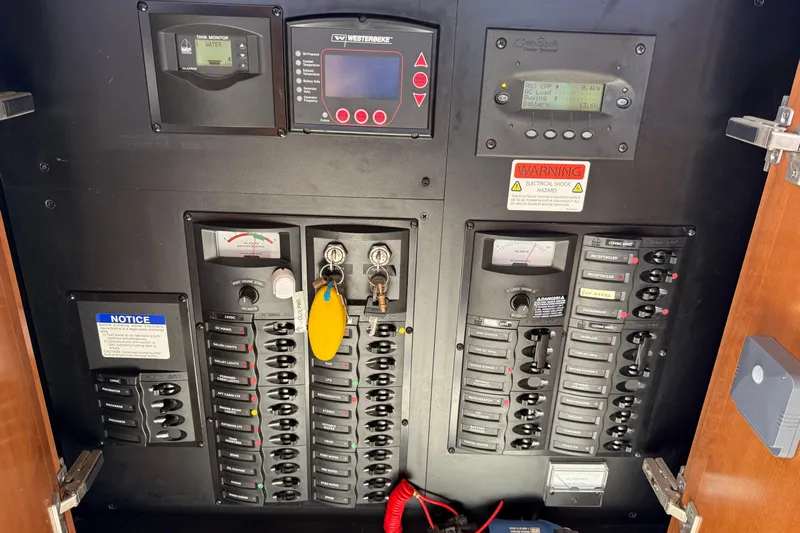 Gra-sea Yacht Photos Pics Electrical control panel inside a 2005 Meridian 381 Sedan boat, featuring various switches and gauges.