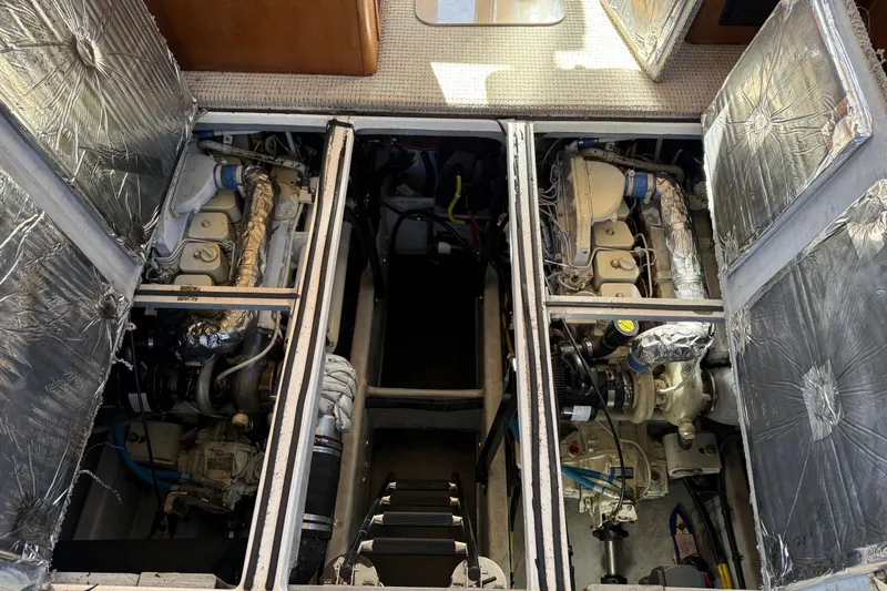Gra-sea Yacht Photos Pics Engine compartment of a 2005 Meridian 381 Sedan boat, showcasing dual engines and insulation.
