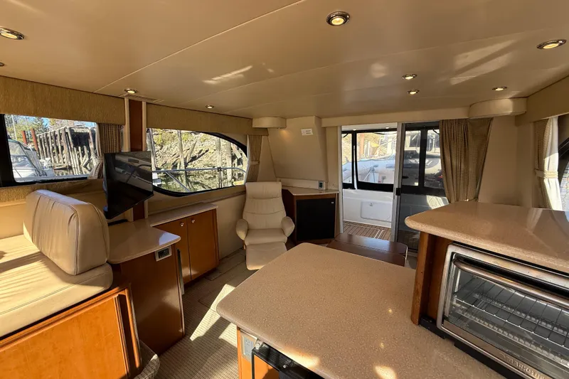 Gra-sea Yacht Photos Pics Interior of 2005 Meridian 381 Sedan yacht with modern furnishings and natural light.