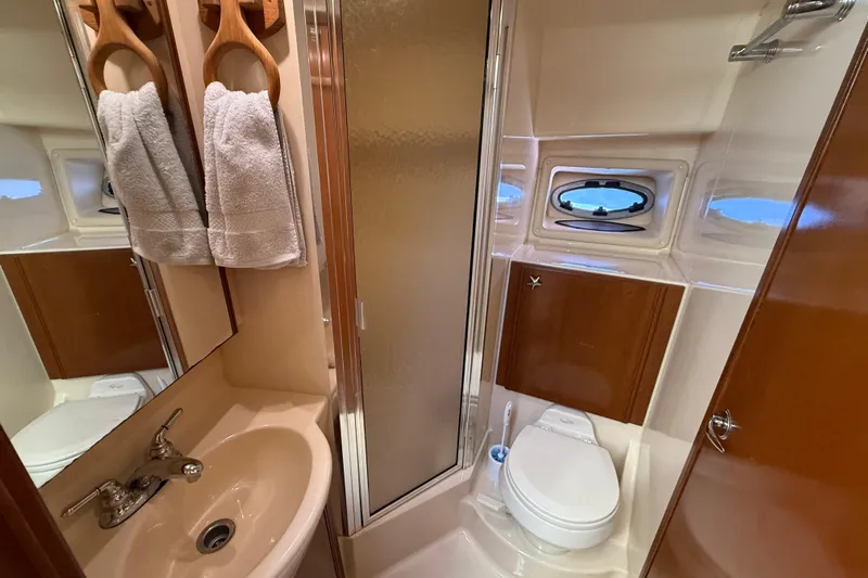 Gra-sea Yacht Photos Pics 2005 Meridian 381 Sedan yacht bathroom with sink, shower, and toilet.