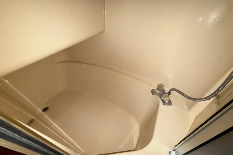 Gra-sea Yacht Photos Pics Cream-colored shower area in a 2005 Meridian 381 Sedan boat.