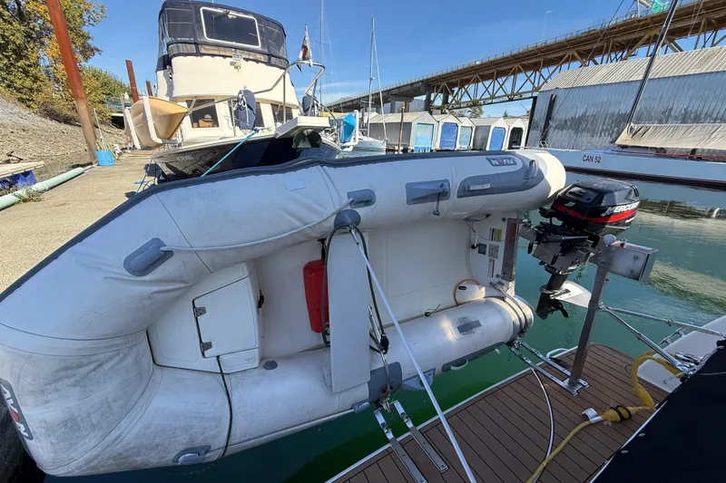 Gra-sea Yacht Photos Pics 2005 Meridian 381 Sedan with inflatable dinghy and outboard motor docked at marina.