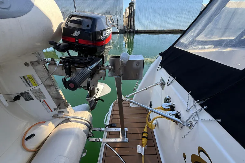 Gra-sea Yacht Photos Pics 2005 Meridian 381 Sedan with outboard motor and inflatable boat on water.