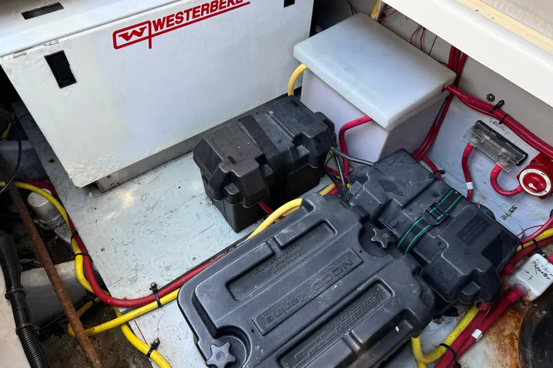 Gra-sea Yacht Photos Pics Engine compartment of a 2005 Meridian 381 Sedan with Westerbeke generator and battery setup.