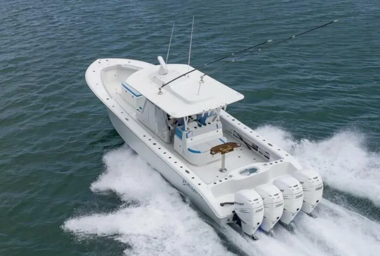  Yacht Photos Pics 2018 Yellowfin 39 boat with four outboard engines cruising on water.