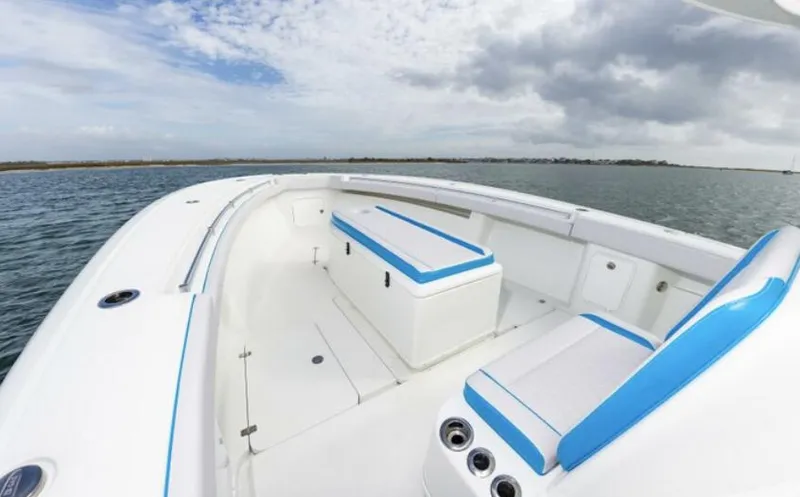  Yacht Photos Pics 2018 Yellowfin 39 boat with white and blue seating on open water.