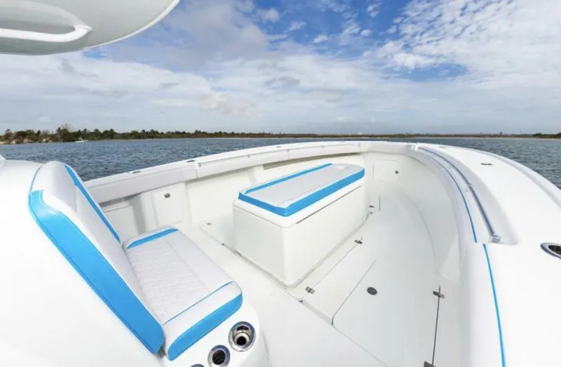  Yacht Photos Pics 2018 Yellowfin 39 boat with white and blue seating on open water.
