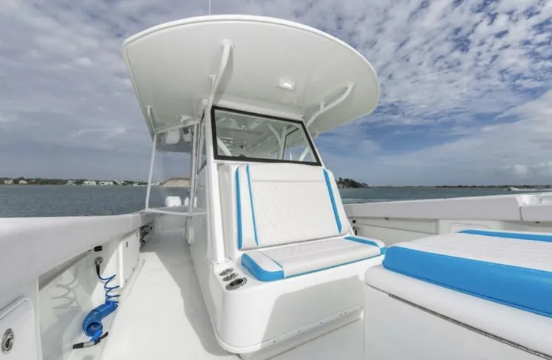  Yacht Photos Pics 2018 Yellowfin 39 boat with white and blue seating on a sunny day.