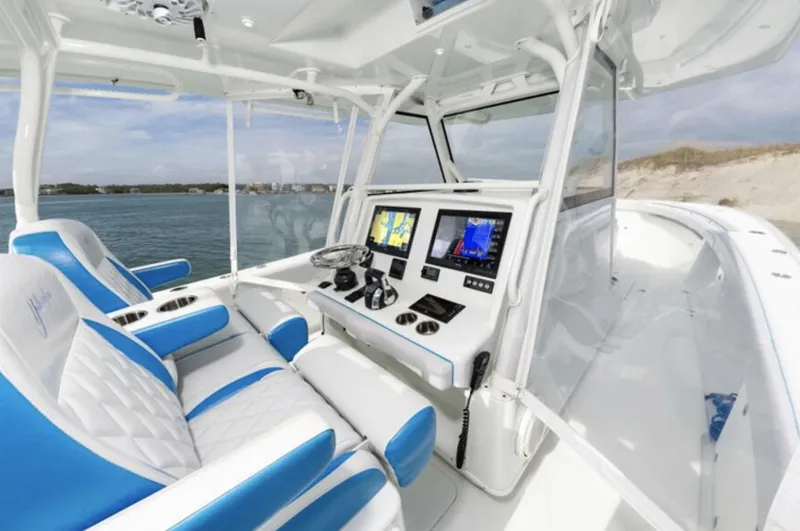  Yacht Photos Pics 2018 Yellowfin 39 boat cockpit with dual screens and blue-white seating.