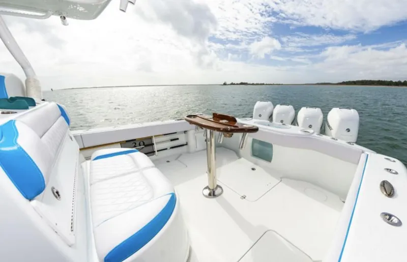  Yacht Photos Pics 2018 Yellowfin 39 boat interior with white and blue seating, ocean view.