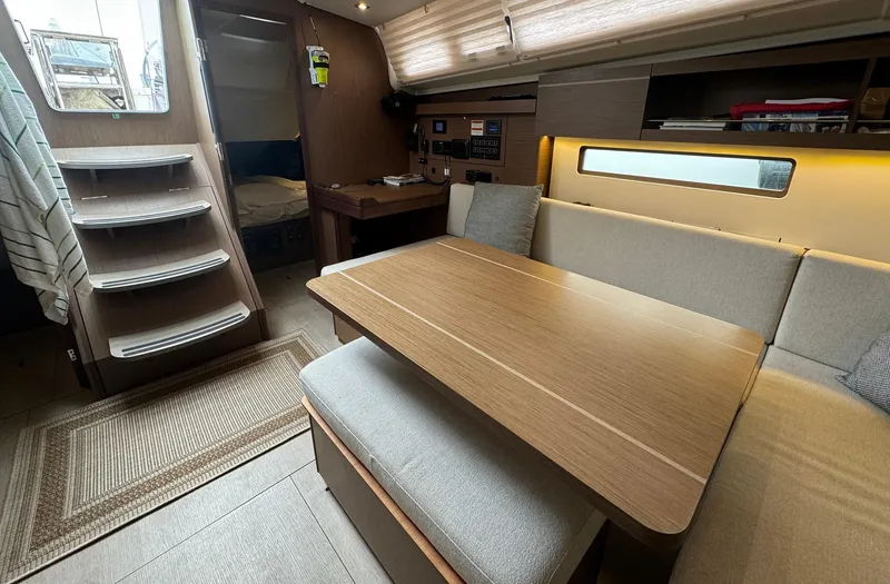 Odyssey Yacht Photos Pics Interior of 2021 Beneteau Oceanis 40.1 yacht, featuring cozy seating and modern design.