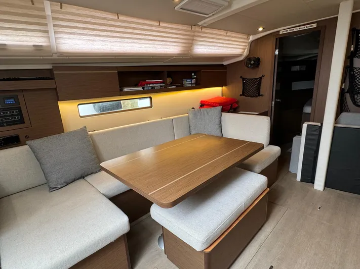 Odyssey Yacht Photos Pics Interior of 2021 Beneteau Oceanis 40.1 yacht with cozy seating and dining area.