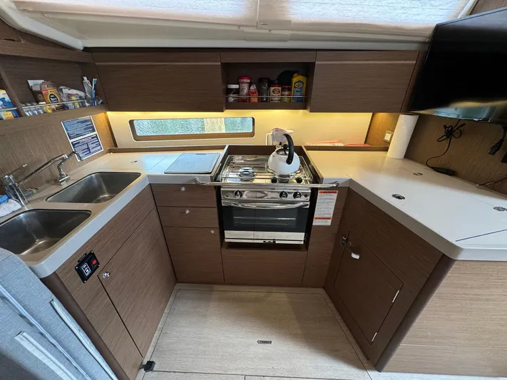 Odyssey Yacht Photos Pics Modern kitchen in 2021 Beneteau Oceanis 40.1 yacht with stove, sink, and storage.