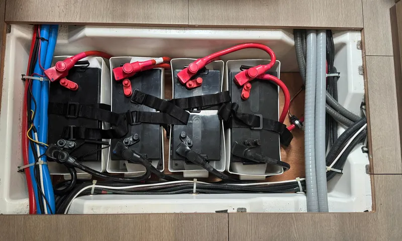 Odyssey Yacht Photos Pics Battery compartment of 2021 Beneteau Oceanis 40.1 sailboat, featuring secured batteries and wiring.