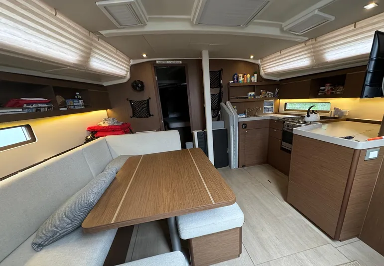Odyssey Yacht Photos Pics Interior of 2021 Beneteau Oceanis 40.1 yacht, featuring modern kitchen and dining area.