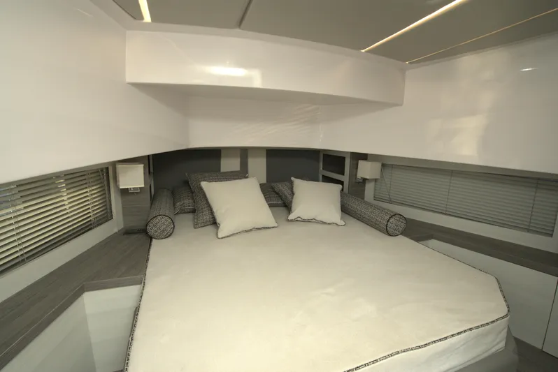  Yacht Photos Pics Luxurious bedroom interior of Nassima Yacht N40, 2025 model, featuring modern design and comfortable bedding.