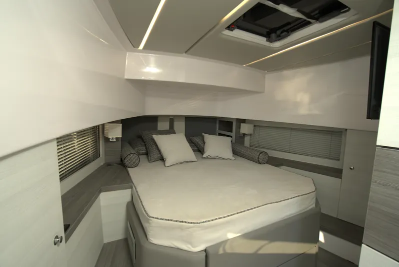  Yacht Photos Pics Luxurious bedroom interior of 2025 Nassima Yacht N40 with modern design and cozy bed.