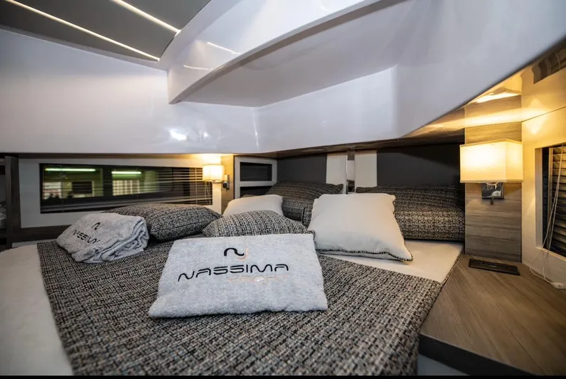  Yacht Photos Pics Luxurious bedroom interior of Nassima Yacht N40, 2025 model, with elegant bedding and ambient lighting.