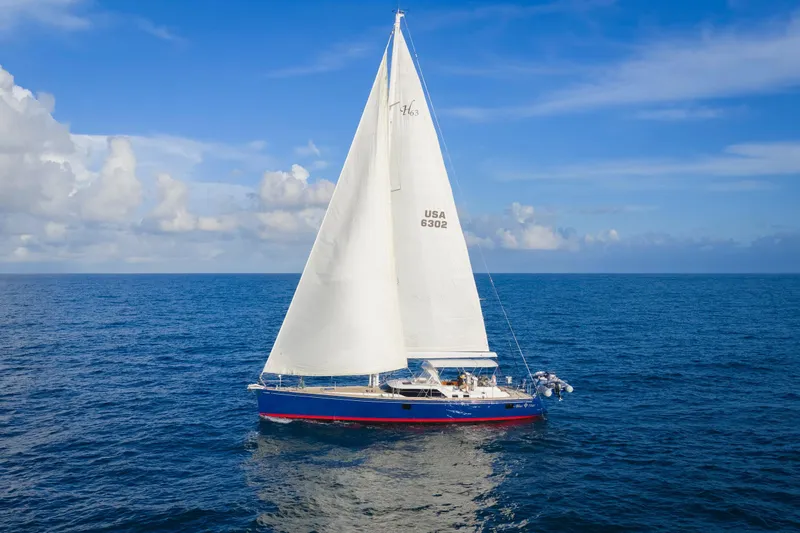 Blue Star Yacht Photos Pics Sailing yacht Hylas 63, 2013 model, cruising on open ocean under clear skies.