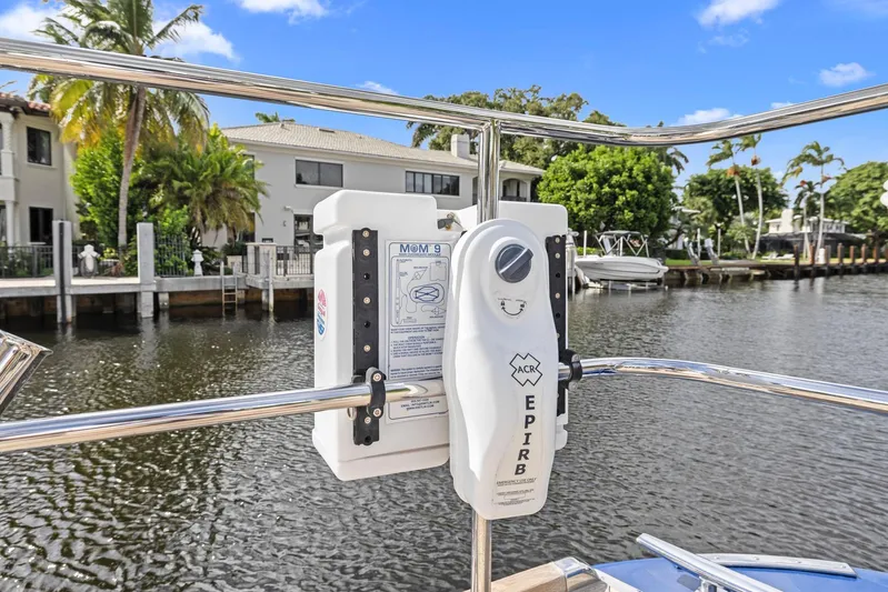 Blue Star Yacht Photos Pics EPIRB device on 2013 Hylas 63 yacht, docked by waterfront homes.